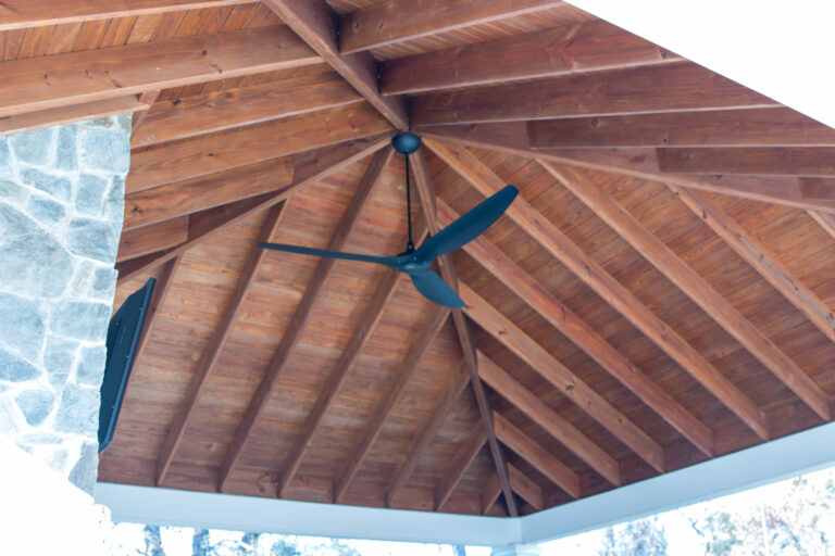 carbbean vinyl outdoor pavilion with a ceiling fan